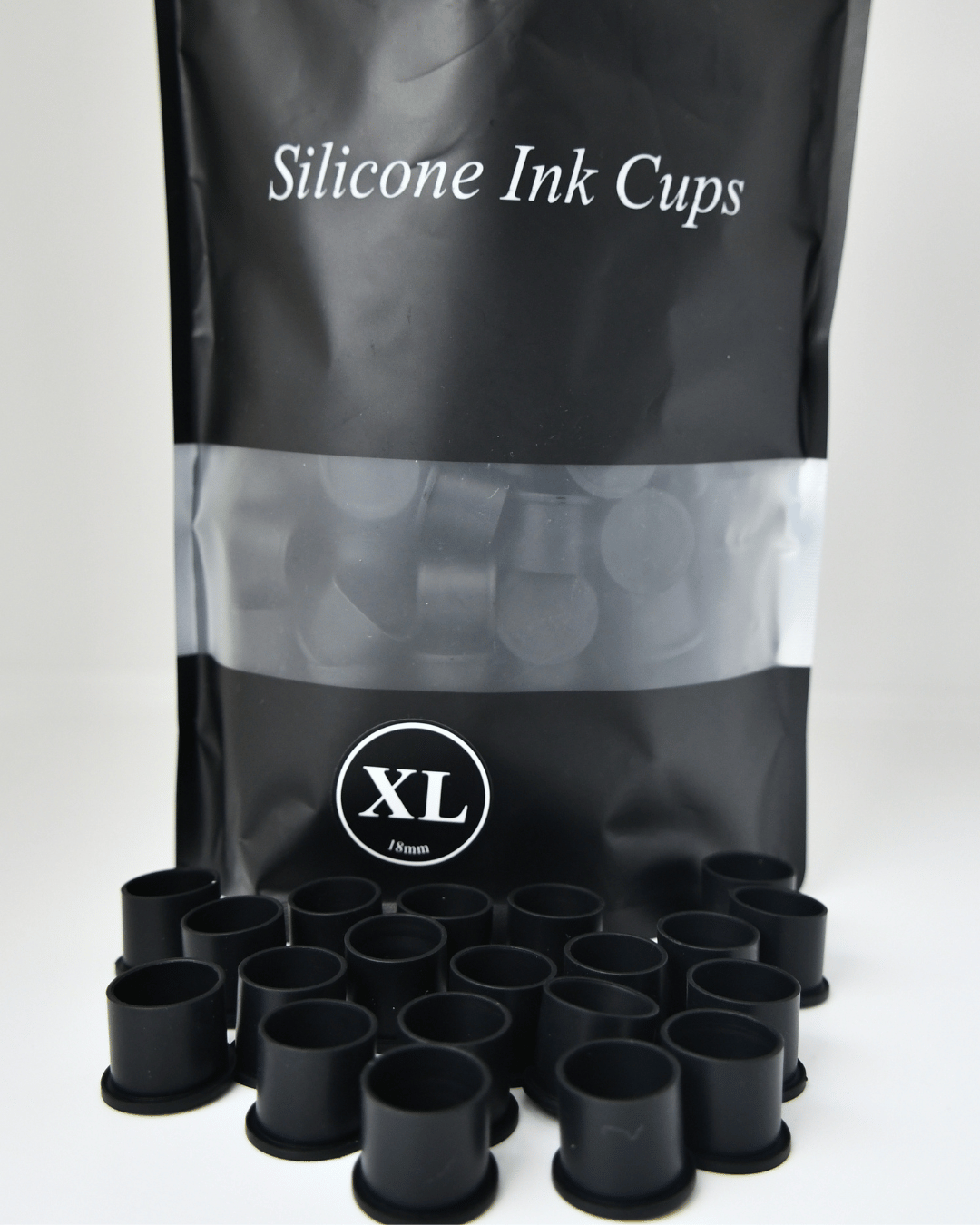 Black silicone ink cups with a black bag labeled 'Silicone Ink Cups XL' on a white background.